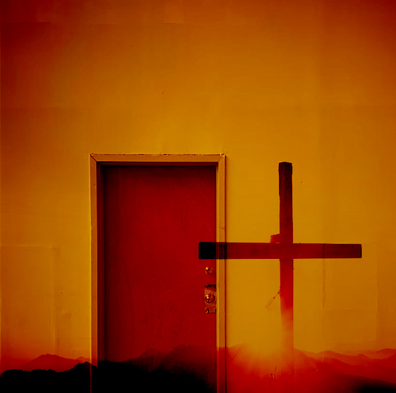 The picture is of a door and a cross next to it.